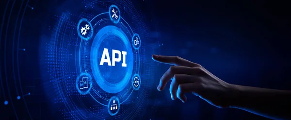 API Application Programming interface software web development concept. Ruční stisk tlačítka na obrazovce. Royalty Free Stock Fotografie