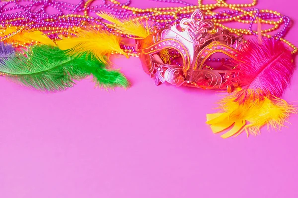 Carnival mask colored feathers traditional sequin beads for Mardi Gras festival purple background — Stock Photo, Image