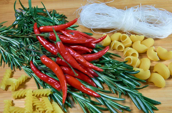 Chili pepper with rosemary — Stock Photo, Image