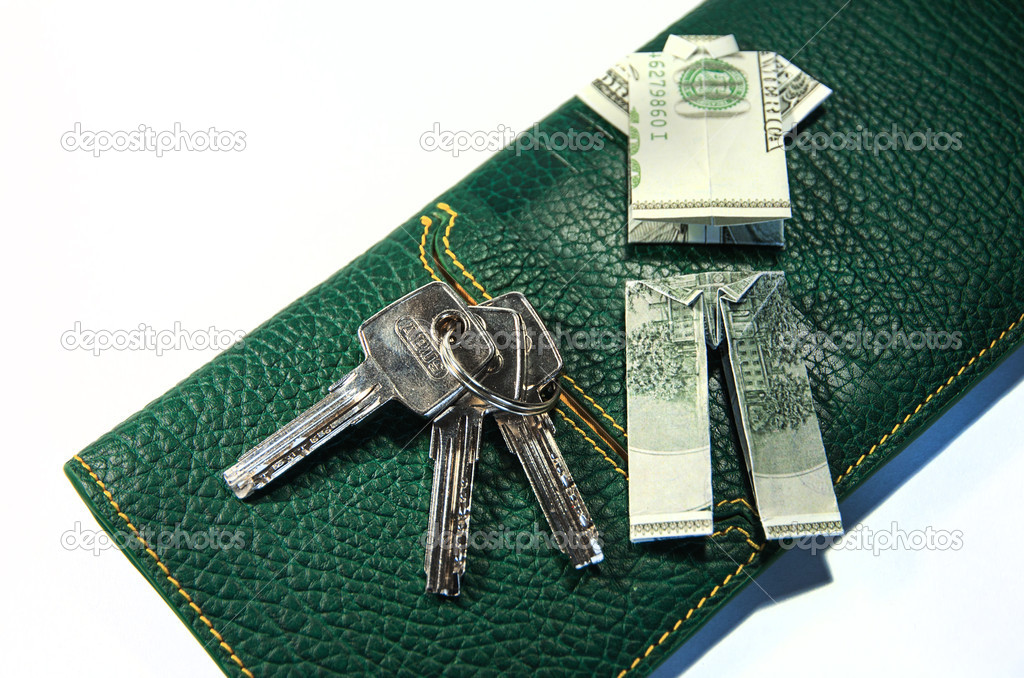 Dollar origami with keys and wallet isolated
