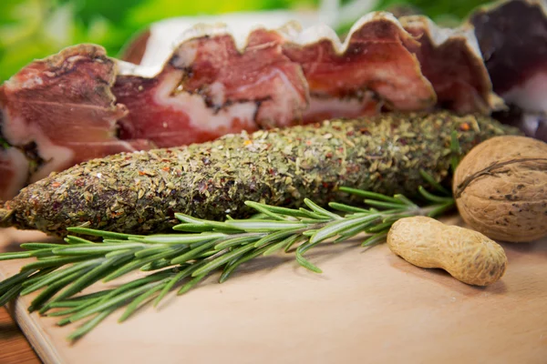 Assorted salami with herbs — Stock Photo, Image