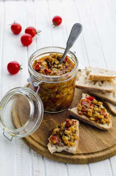 Eggplant caviar in a glass jar with croutons — Stock Image Eggplant caviar in a glass jar with croutons Royalty Free Stock Images
