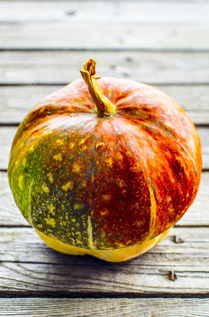 Decorative pumpkin on a wooden table