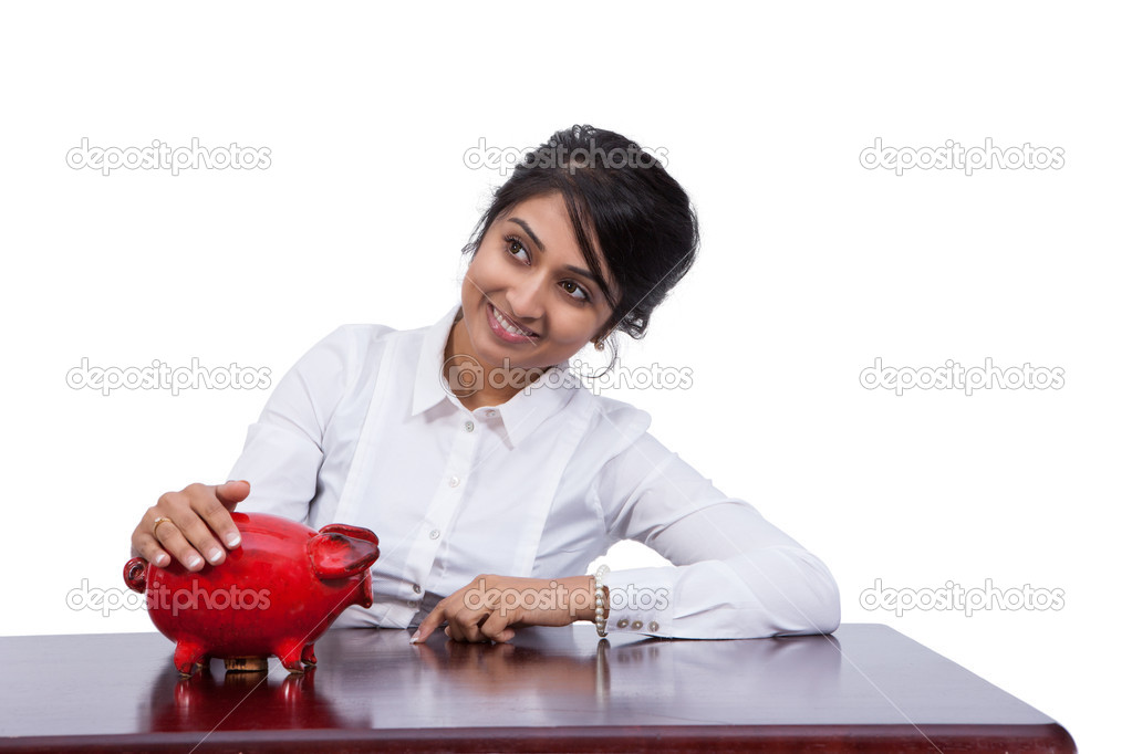Businesswoman with piggy bank