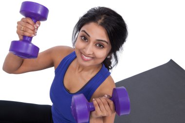 Young female with dumbbells clipart