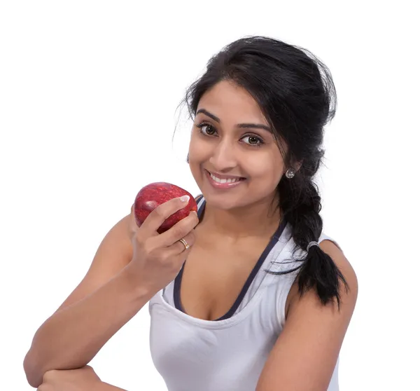 Mujer sonriente sosteniendo una manzana —  Fotos de Stock