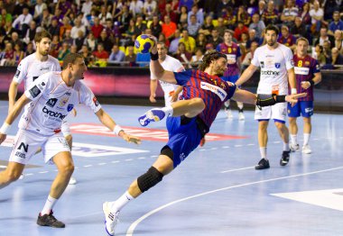 Handball match FC Barcelona vs Montpellier clipart