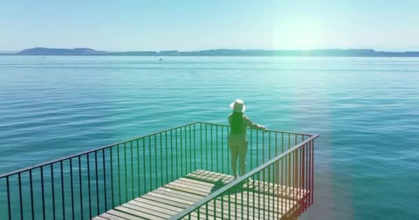 Aerial Video Happy Carefree Woman Standing Pier Looking Sea — Stockvideo