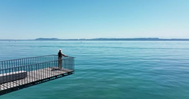 Aerial Video Happy Carefree Woman Standing Pier Looking Sea — Stockvideo