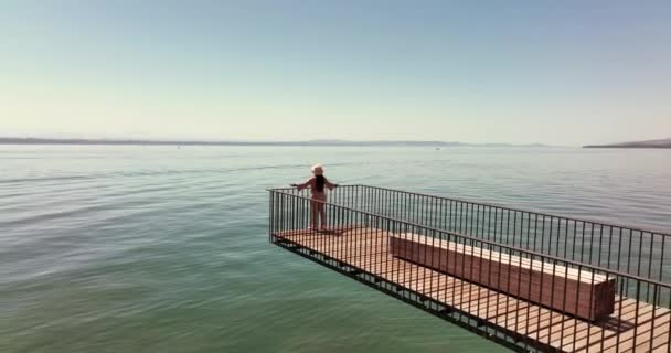 Aerial Video Happy Carefree Woman Standing Pier Looking Sea — Stockvideo
