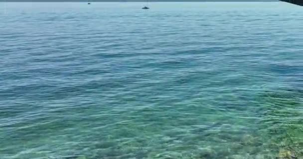 Aerial video of happy carefree woman standing on pier and looking at sea