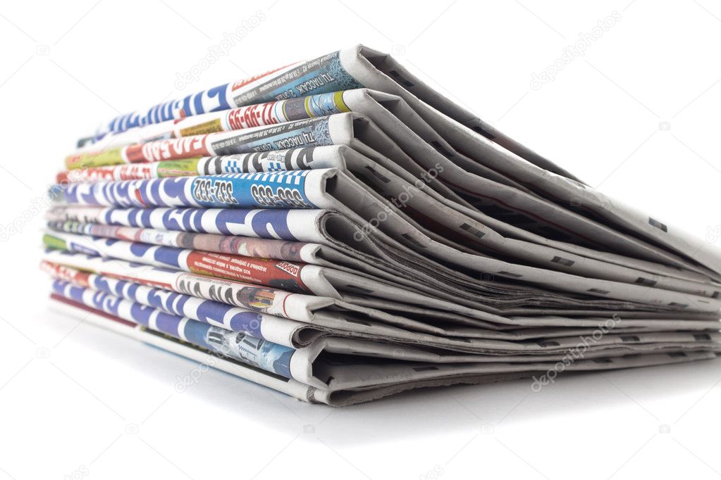 stack of newspapers on a white background