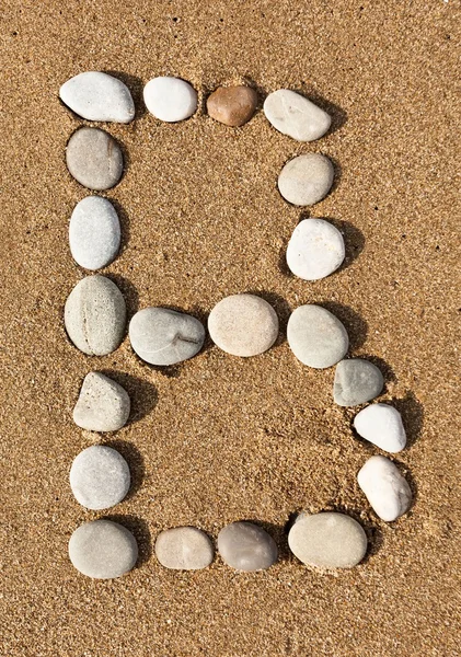 English letter by stones — Stock Photo, Image