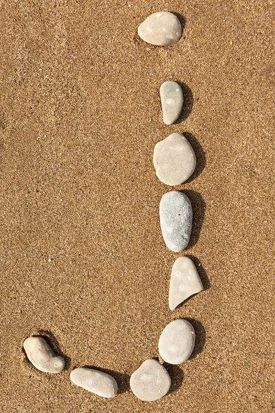 English letter by stones — Stock Photo, Image