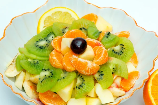 Salade de fruits en vase et orange — Photo