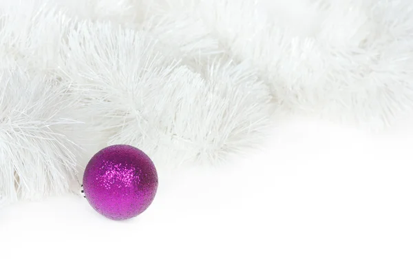 Violet ball and white Christmas tinsel — Stock Photo, Image