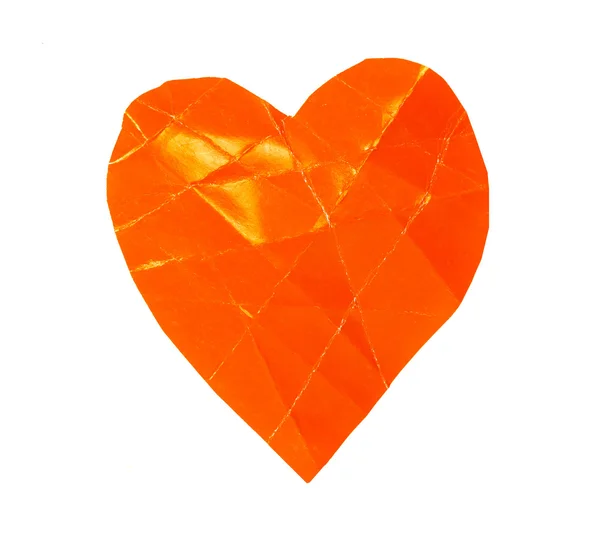 Eine orangefarbene Papier-Herzform — Stockfoto