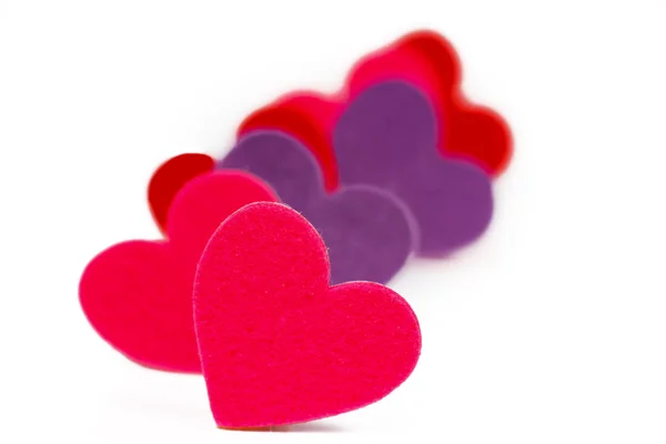 Many colored heart shapes in a row — Stock Photo, Image