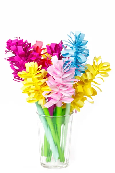 Bouquet of colored paper flowers in the faceted glass — Stock Photo, Image