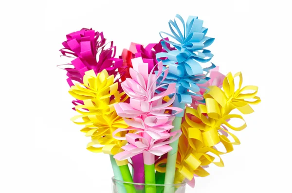 Bouquet of colored paper flowers in the faceted glass — Stock Photo, Image