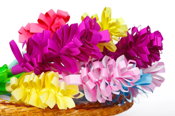 Many colored paper flowers in the basket — Stock Photo, Image