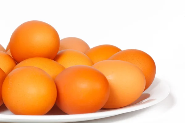 Colored eggs on a plate — Stock Photo, Image