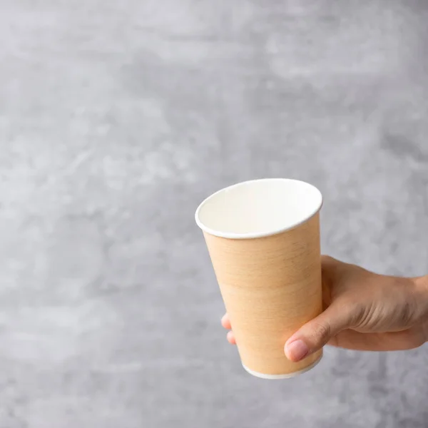 Eco friendly food packaging or takeaway coffee cup. Hand holding natural container for to go. zero waste, pollution, earth day, free plastic, world Environment day concept