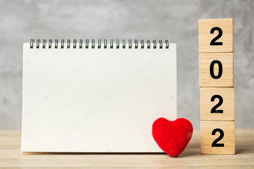 2022 cubes with red heart shape and empty notebook on table for your text. New Year, Resolution, Goal, plan, health, Love and Happy Valentine day concept