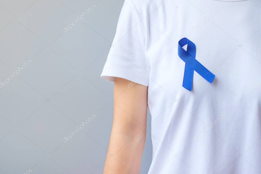 March Colorectal Cancer Awareness month,  dark Blue Ribbon for supporting people living and illness. Healthcare, hope and World cancer day concept