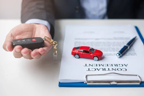 Businessman Hand Holding Remote Keyless Car Toy Pen Contract Document — Stock Photo, Image