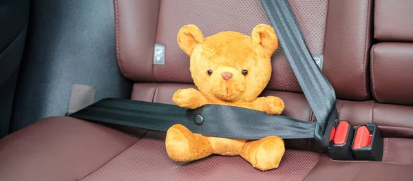 Yellow Bear Doll Fastening Seat Belt Sitting Car Driving Road — Stock Photo, Image
