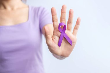 purple Ribbon for Violence, Pancreatic, Esophageal, Testicular cancer, Alzheimer, epilepsy, lupus, Sarcoidosis and Fibromyalgia. Awareness month and World cancer day concept