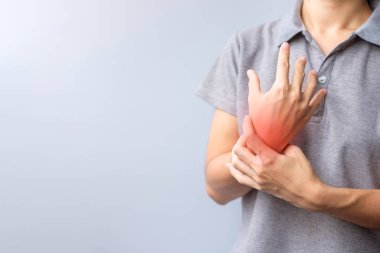 woman holding her wrist pain because using smartphone or computer long time. De Quervain s tenosynovitis, Intersection Symptom, Carpal Tunnel Syndrome or Office syndrome concept