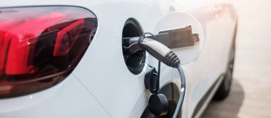 Electric car charging battery at EV charger station or home. green energy power, Eco friendly alternative, technology and environment concepts