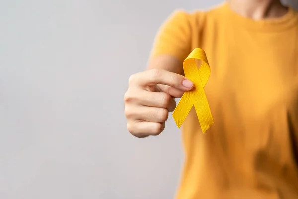 Yellow September, Suicide prevention day, Childhood, Sarcoma, bone and bladder cancer Awareness month, Yellow Ribbon for supporting people life and illness. Healthcare and World cancer day concept
