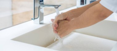 Washing hands with liquid soap and tap water, Antiseptic, personal Hygiene and Healthcare concept