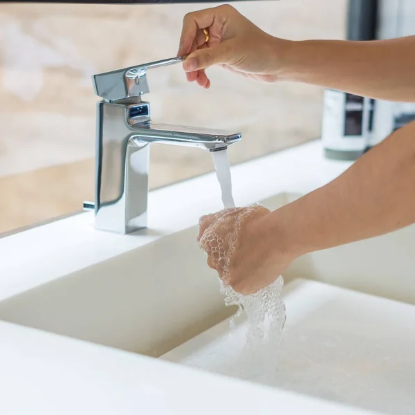 Washing hands with liquid soap and tap water, Antiseptic, personal Hygiene and Healthcare concept