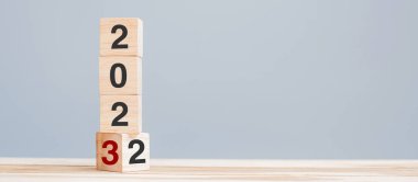 2022 chang to 2023 wooden cube blocks on table background. Resolution, plan, review, goal, start, end year  and New Year holiday concepts