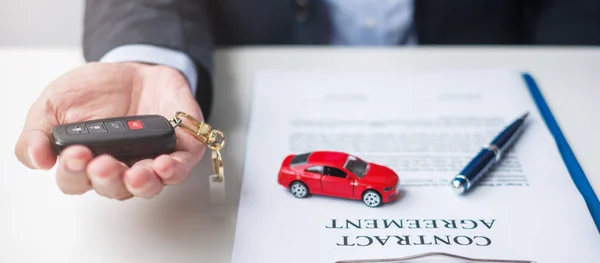 Businessman Hand Holding Red Car Toy Vehicle Keyless Pen Contract — Stock Photo, Image