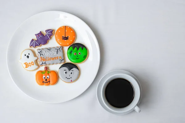hot coffee cup with funny Halloween Cookies. Happy Halloween day, Trick or Threat, Hello October, fall autumn, Traditional, party and holiday concept