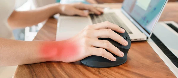 woman hand using computer ergonomic mouse, prevention wrist pain because working long time. De Quervain s tenosynovitis, Intersection Symptom, Carpal Tunnel Syndrome or Office syndrome concept