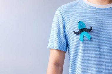 November Prostate Cancer Awareness month, Blue Ribbon with mustache for supporting people living and illness. Healthcare, International men, Father and World cancer day concept clipart
