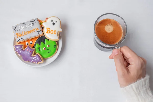 Woman Hand Holding Coffee Cup Eating Funny Halloween Cookies Happy — Stock Photo, Image