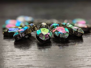 bracelet with colored crystals on a dark table close up