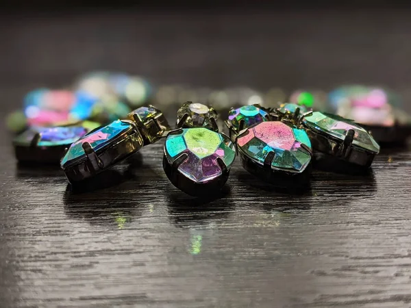 bracelet with colored crystals on a dark table close up