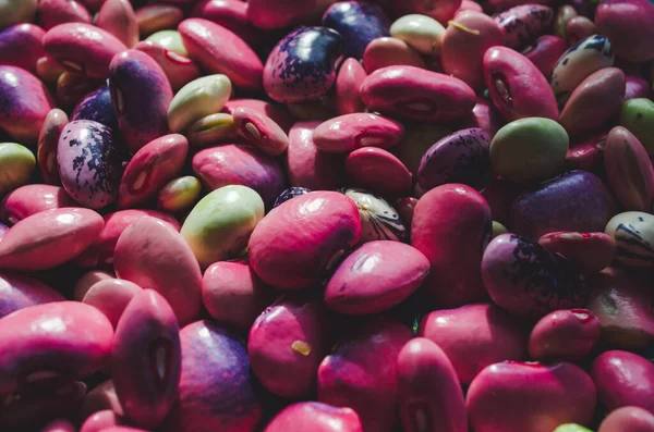 mixed beans pink and green, background close up