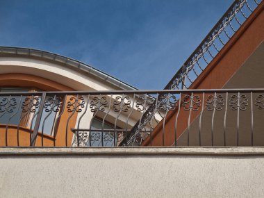 Balconies with wrought iron railings clipart