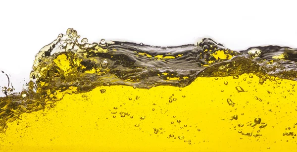 黄色の液体をこぼしたの抽象的なイメージ。白い背景の上 — ストック写真