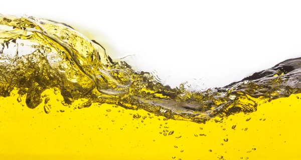 Imagem abstrata de um líquido amarelo derramado. Em um fundo branco — Fotografia de Stock