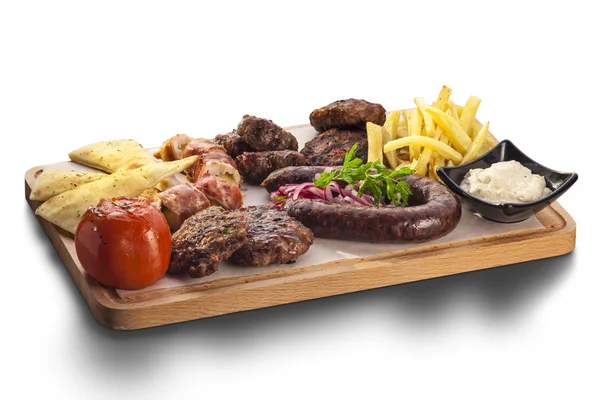 Wholesome platter of mixed meats including grilled steak — Stock Photo, Image